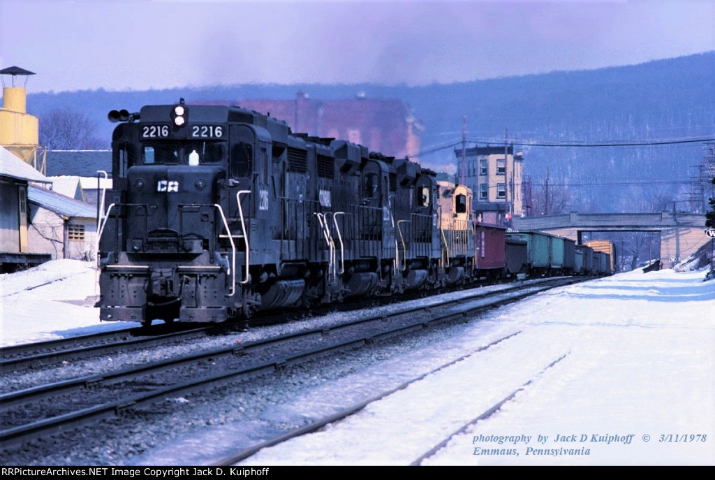 Conrail, CR, GP30s 2216-2225-2217-2170, with westbound APB-1 on the ex-Reading Line at, Emmaus, Pennsylvania. March 11, 1978. 